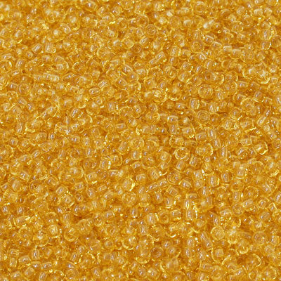 #11/0 ROCAILLES - APPROX 40G - TRANSPARENT LIGHT AMBER