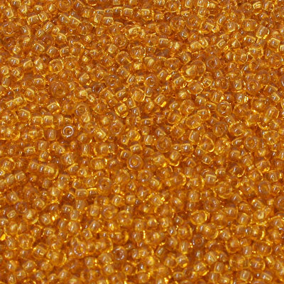 #11/0 ROCAILLES - APPROX 40G - TRANSPARENT AMBER