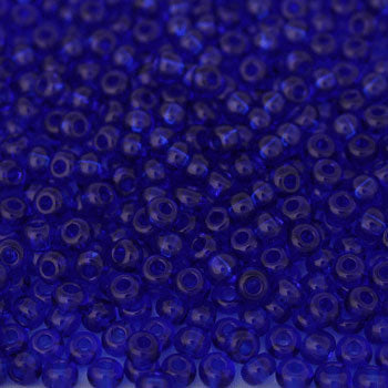 #6/0 ROCAILLES - APPROX 40G - TRANSPARENT DARK BLUE